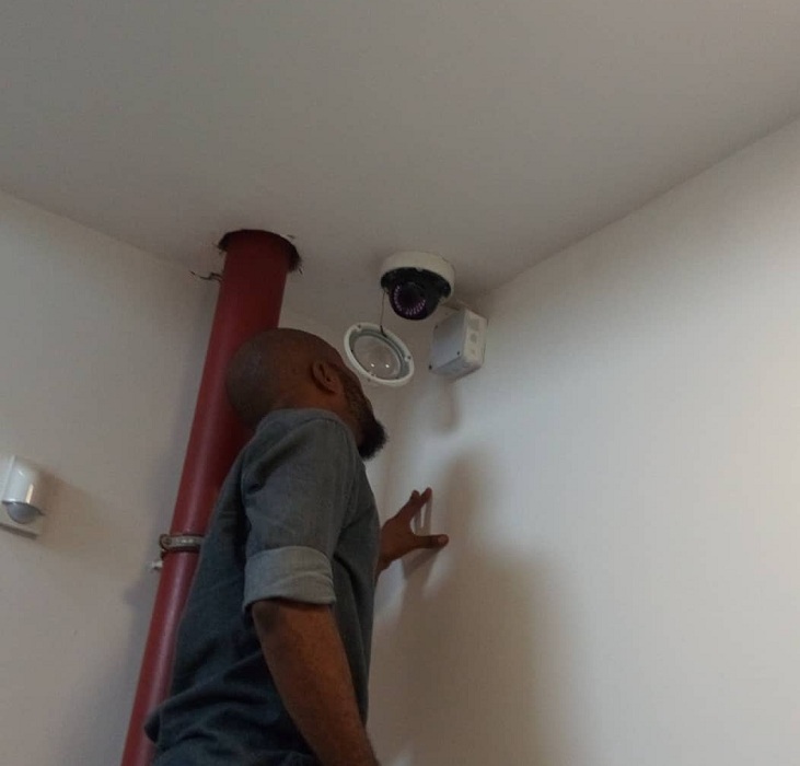 An engineer connecting a CCTV